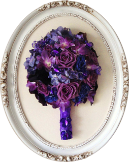 Preserved floral keepsake in an oval frame.